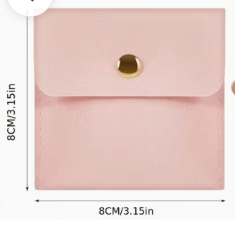 Pink faux leather envelope-style card holder or coin pouch with a gold snap button, shown both flat with dimensions labeled 8CM/3.15in and being held in a hand.
